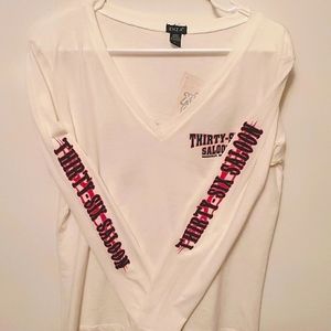 Long Sleeve v-neck Tshirt in a size large.  White, pink and black graphic shirt.